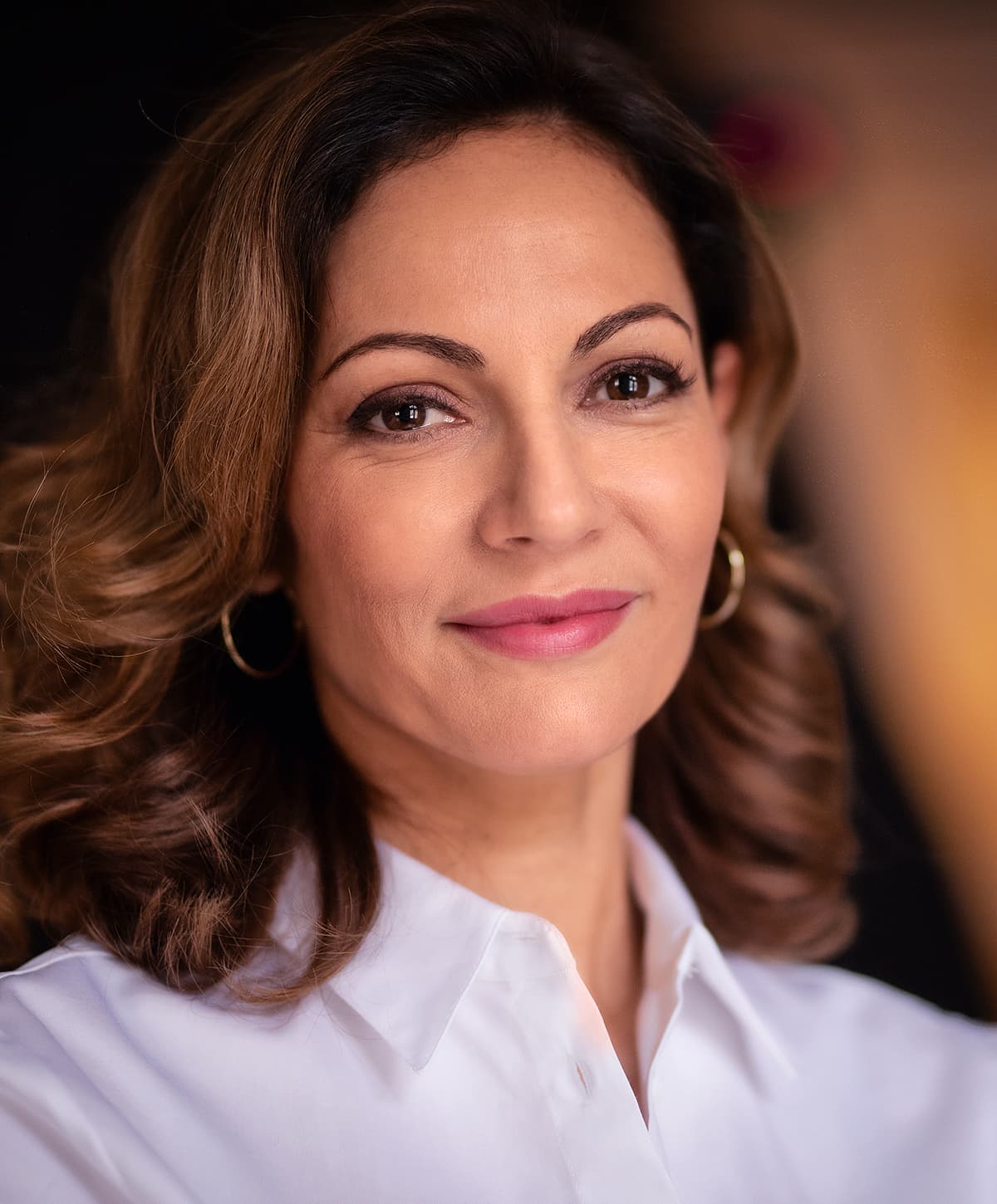 Roseville ultherapy model with curly dark hair